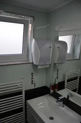 a bathroom with a sink and a mirror at Hotel Vrata Bosne in Velika Kladuša