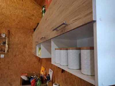 a row of rolls of toilet paper on a shelf at Forest Lodge on the Pyramid in Visoko