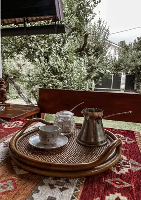 a tray with a tea kettle and a cup on a table at Holiday Home Amila in Visoko