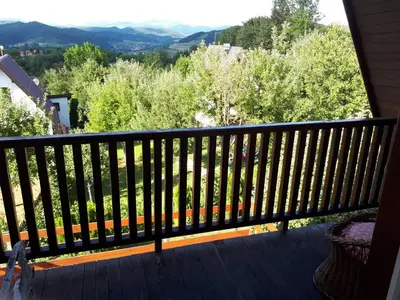 a balcony with a view of trees and mountains at Holiday Home Amila in Visoko