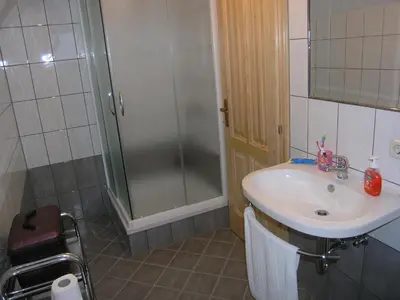 a bathroom with a sink and a shower at Planinska kuća Kupres in Kupres