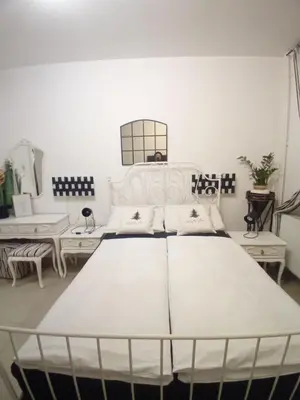a large white bed in a room at Apartment Top Centar in Banja Luka