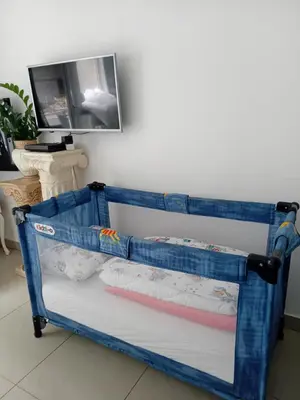 a blue crib bed frame in a room at Apartment Top Centar in Banja Luka