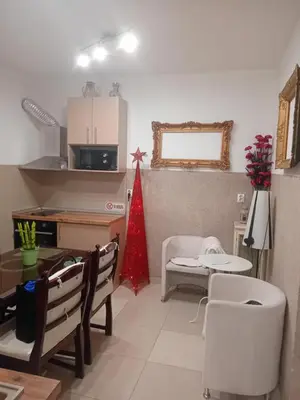 a kitchen and dining room with a table and chairs at Apartment Top Centar in Banja Luka