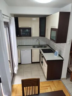 a kitchen with a sink and a counter top at Apartmani Čolić Vlašić in Vlasic