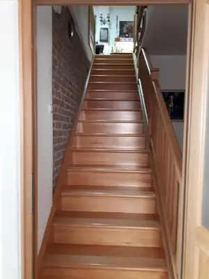 a flight of wooden stairs in a house at Apartment Sun in Visoko
