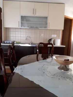 a kitchen with a table with a bowl on it at Apartment Sun in Visoko