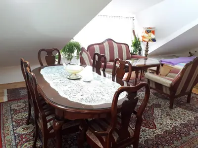 a dining room with a table and chairs at Apartment Sun in Visoko