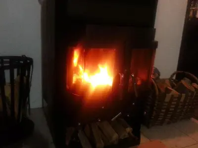 a fire in a fireplace in a room at Chalet The Best View in Vlasic