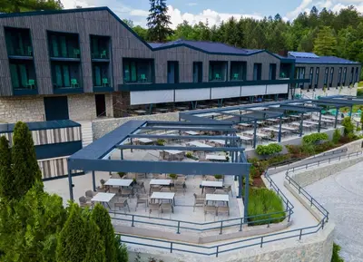 an overhead view of a building with tables and chairs at Hotel Plivsko jezero in Jajce