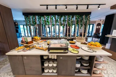 a buffet with fruits and vegetables on a counter at Hotel Plivsko jezero in Jajce