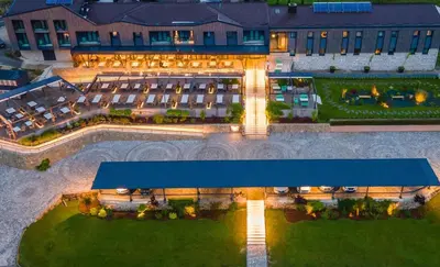 an overhead view of a hotel with a blue roof at Hotel Plivsko jezero in Jajce