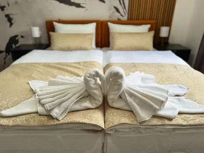 a bed with towels on top of it at Hotel Turist 98 in Jajce