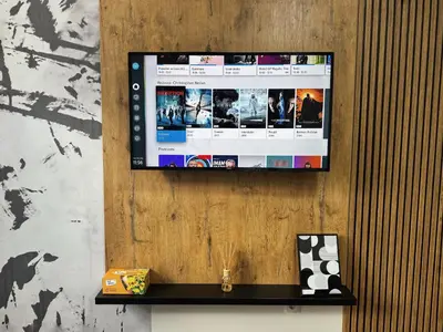 a flat screen tv hanging on a wall at Hotel Turist 98 in Jajce
