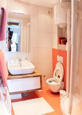 a bathroom with a sink and a toilet at Apartman Ena in Vlasic