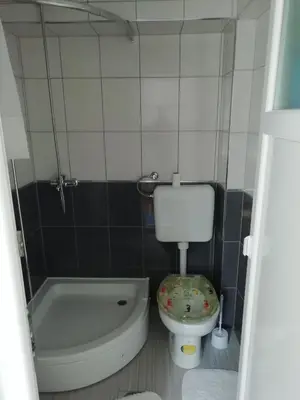 a bathroom with a toilet and a tub and a sink at Apartment Beganovic in Kulen Vakuf
