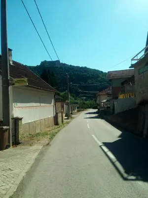 an empty street in a village with at Apartment Beganovic in Kulen Vakuf