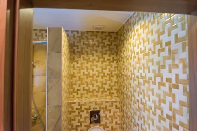 a bathroom with a shower and a toilet at Motel Orhideja in Donji Vakuf