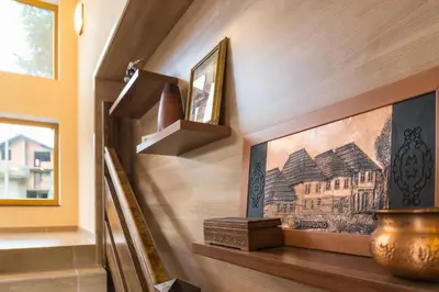 a staircase in a house with a painting on the wall at Motel Orhideja in Donji Vakuf