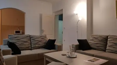 a living room with two couches and a table at Apartment MA in Banja Luka