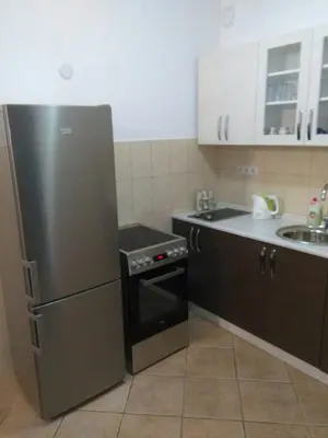 a kitchen with a stainless steel refrigerator and a sink at Apartment MA in Banja Luka