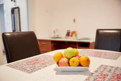 a bowl of fruit sitting on a table at Central Tuzla apt - free parking in Tuzla
