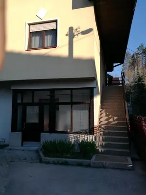 a building with a staircase in front of a building at Central Tuzla apt - free parking in Tuzla
