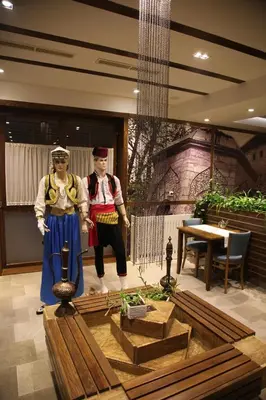 two mannequins dressed in costumes in a room at Motel Korzo in Bihać