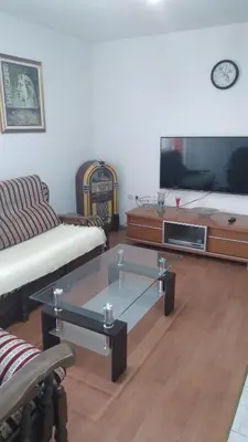 a living room with a couch and a coffee table at Apartman Anita in Livno