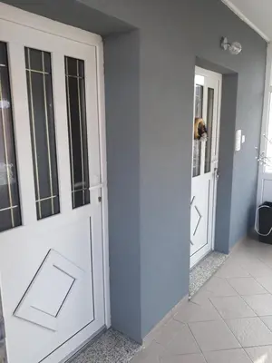 a room with a white door and a mirror at Apartman Anita in Livno