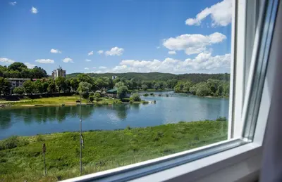 a view of a river from a window at Motel New Sanatron in Bosanski Novi
