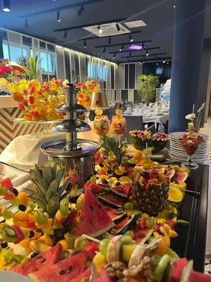 a buffet line with many different types of food at Swiss Plus Hotel in Bihać