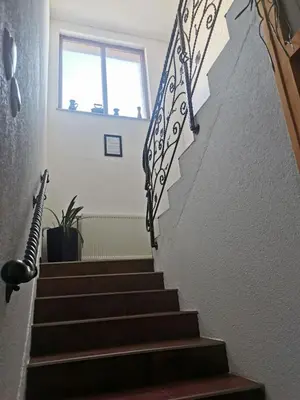 a stairway with a black and white railing at House Leyla in Bihać