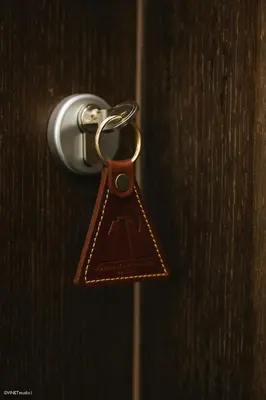 a key chain hanging from a wooden door at Becar Pyramid Rooms in Visoko