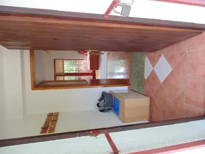 a kitchen with a counter and a box in a room at Holiday Home Alibegović in Visoko