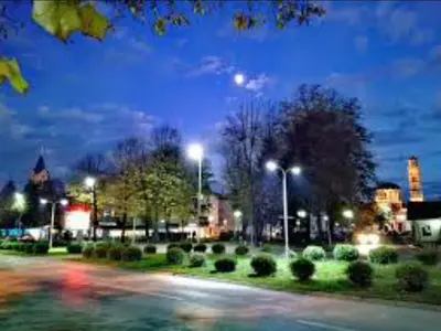 a city street with street lights at night at Guesthouse Jelic in Teslić