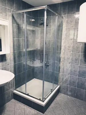 a shower with a glass door in a bathroom at holiday home RIVER HOUSE in Jajce