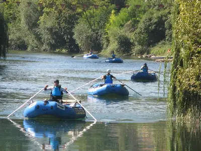 a group of people in rafts on a river at Apartment Mirjana in Banja Luka