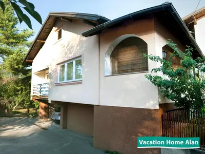 a building with a window on the side of it at Vacation home Alan in Kulen Vakuf