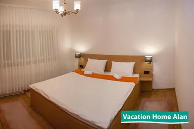 a bedroom with a large bed in a room at Vacation home Alan in Kulen Vakuf