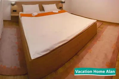 a large bed in a room with at Vacation home Alan in Kulen Vakuf