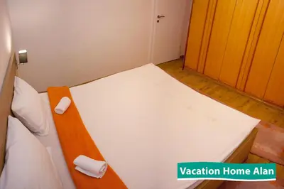 a small room with a bed in a room at Vacation home Alan in Kulen Vakuf