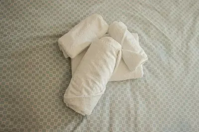 a pair of white towels laying on the floor at Apartments Bašić in Visoko