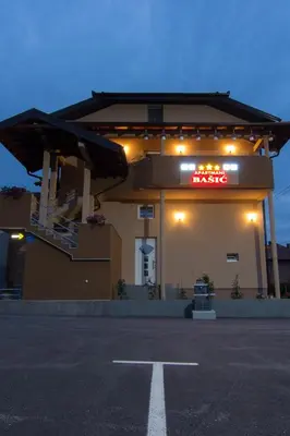 a gas station with a sign on the side of it at Apartments Bašić in Visoko