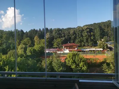 a view of a baseball field from a window at Apartman Banja - Tuzla in Tuzla