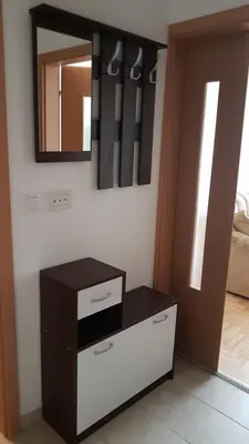 a room with a mirror and a dresser with a mirror at Apartman Banja - Tuzla in Tuzla