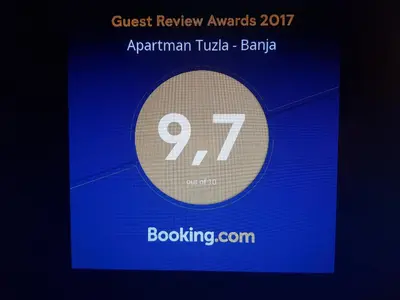 a sign with the on a blue background at Apartman Banja - Tuzla in Tuzla