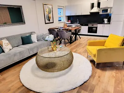 a living room with a couch and a table at Apartmani Jasmina 2 in Bihać
