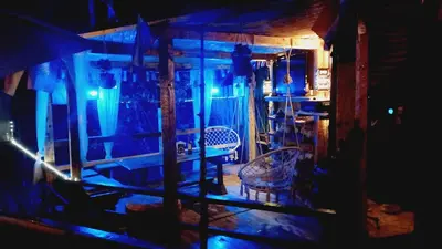 a room with blue lights and a table and chairs at Holiday Home Nature Neno in Visoko