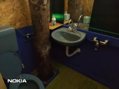 a bathroom with a sink and a toilet and a mirror at Holiday Home Nature Neno in Visoko